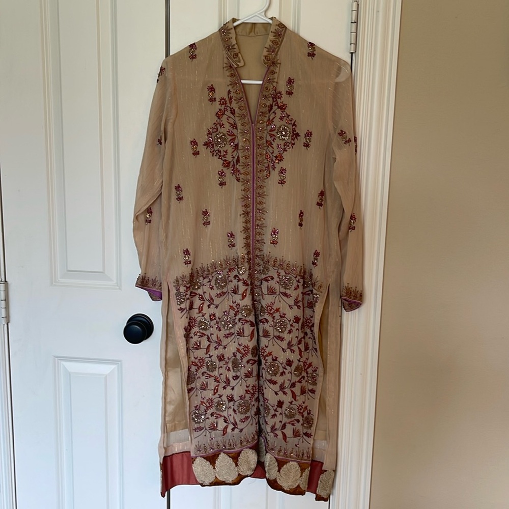 Pakistani Indian embroidered formal kurta.